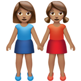 Deux Femmes Se Tenant La Main (peau légèrement mate)
